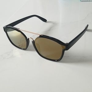 Black frame sunglasses with gold bronze lenses
